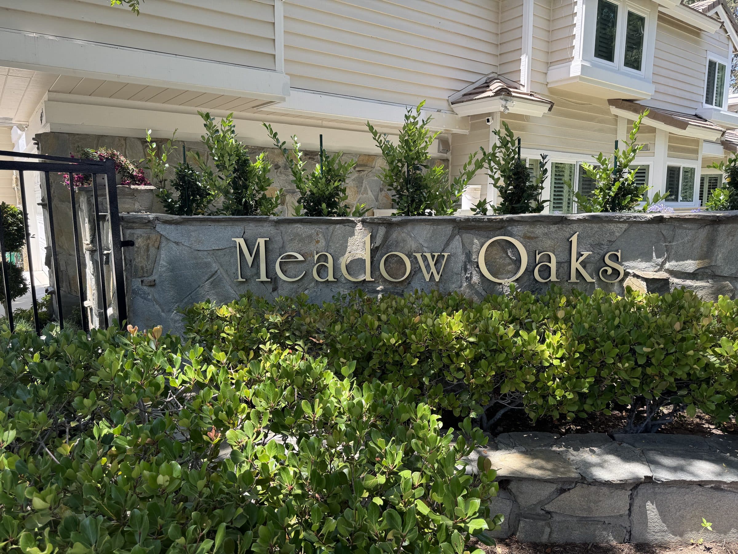 The stone monument entry with brass lettering