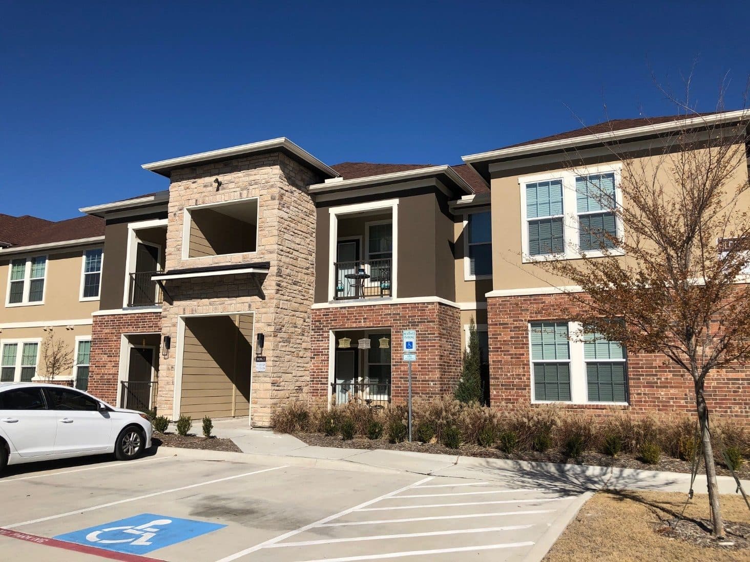 The completed two-story stone and brick elevation